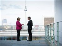 Макрон и Меркель: спор о деньгах за кулисами переговоров